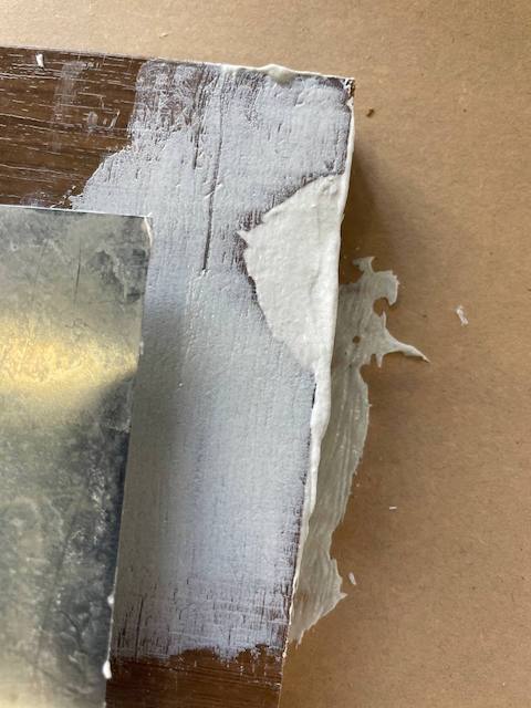 Aprende a pintar muebles de oficina de melamina 10 Tapamos el agujero en el mueble de oficina de melamina con masilla